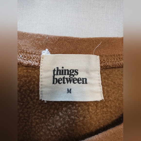 🟢3/$11 Things Between Oversized Brown Smiley Face Sweatshirt - Picture 6 of 6